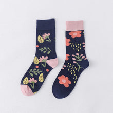 Load image into Gallery viewer, Pair of floral-patterned socks on a light gray background