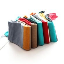Load image into Gallery viewer, Colorful socks arranged in a row on a white background
