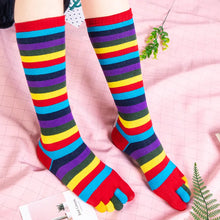 Load image into Gallery viewer, Colorful striped toe socks on a pink checkered background