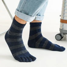 Load image into Gallery viewer, Person wearing blue and gray striped toe socks with rolled-up jeans.