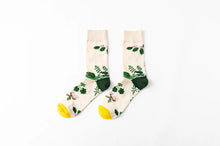 Load image into Gallery viewer, Pair of socks with plant pattern on a white background