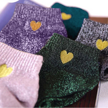 Load image into Gallery viewer, Five pairs of socks with heart designs on a white surface.