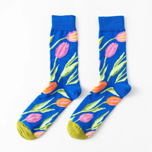Load image into Gallery viewer, Blue socks with pink tulip pattern on a white background