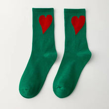 Load image into Gallery viewer, Green socks with red hearts on a white background