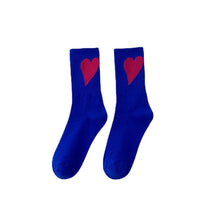 Load image into Gallery viewer, Pair of blue socks with red hearts on a white background