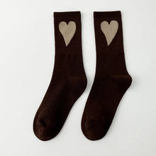 Load image into Gallery viewer, Pair of brown socks with beige hearts on a white background