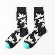 Load image into Gallery viewer, Black socks with white dove patterns and turquoise toes on a white background