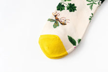 Load image into Gallery viewer, Sock with yellow toe and insect design on a white background