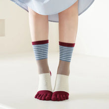 Load image into Gallery viewer, Person wearing striped socks with a white background