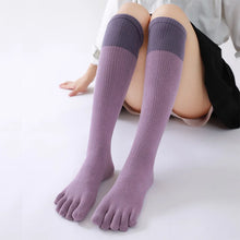 Load image into Gallery viewer, A pair of purple knee-high socks with distinct toe separation, designed for comfort and reducing toe friction.