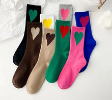 Load image into Gallery viewer, Set of colorful socks with heart designs on a white background