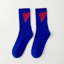 Load image into Gallery viewer, Pair of blue socks with red hearts on a white background