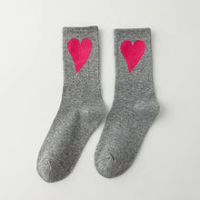 Load image into Gallery viewer, Gray socks with pink hearts on a white background