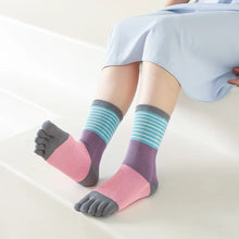 Load image into Gallery viewer, Colorful toe-separated socks worn by a person on a light background