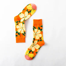 Load image into Gallery viewer, Pair of socks with floral design on a white background