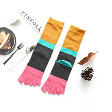 Load image into Gallery viewer, Colorful five-finger socks with a plate of toast and a fork on a white surface.