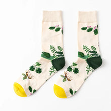 Load image into Gallery viewer, Pair of socks with nature-themed design on a white background
