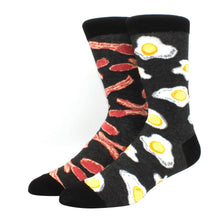 Load image into Gallery viewer, Two socks with bacon and egg pattern on a white background
