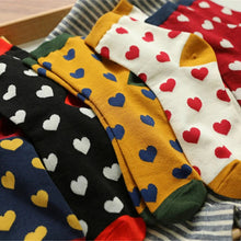 Load image into Gallery viewer, Colorful socks with heart patterns on a wooden tray
