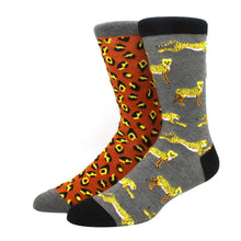 Load image into Gallery viewer, Two pairs of socks with animal print patterns on a white background
