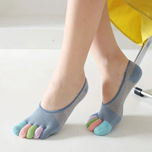 Load image into Gallery viewer, Person wearing blue toe-separated socks with colorful toes on a light background
