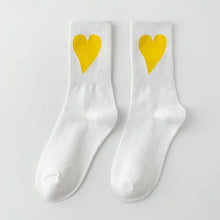Load image into Gallery viewer, White socks with yellow hearts on a light gray background

