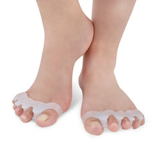 Load image into Gallery viewer, Transparent toe separators worn on feet against a white background
